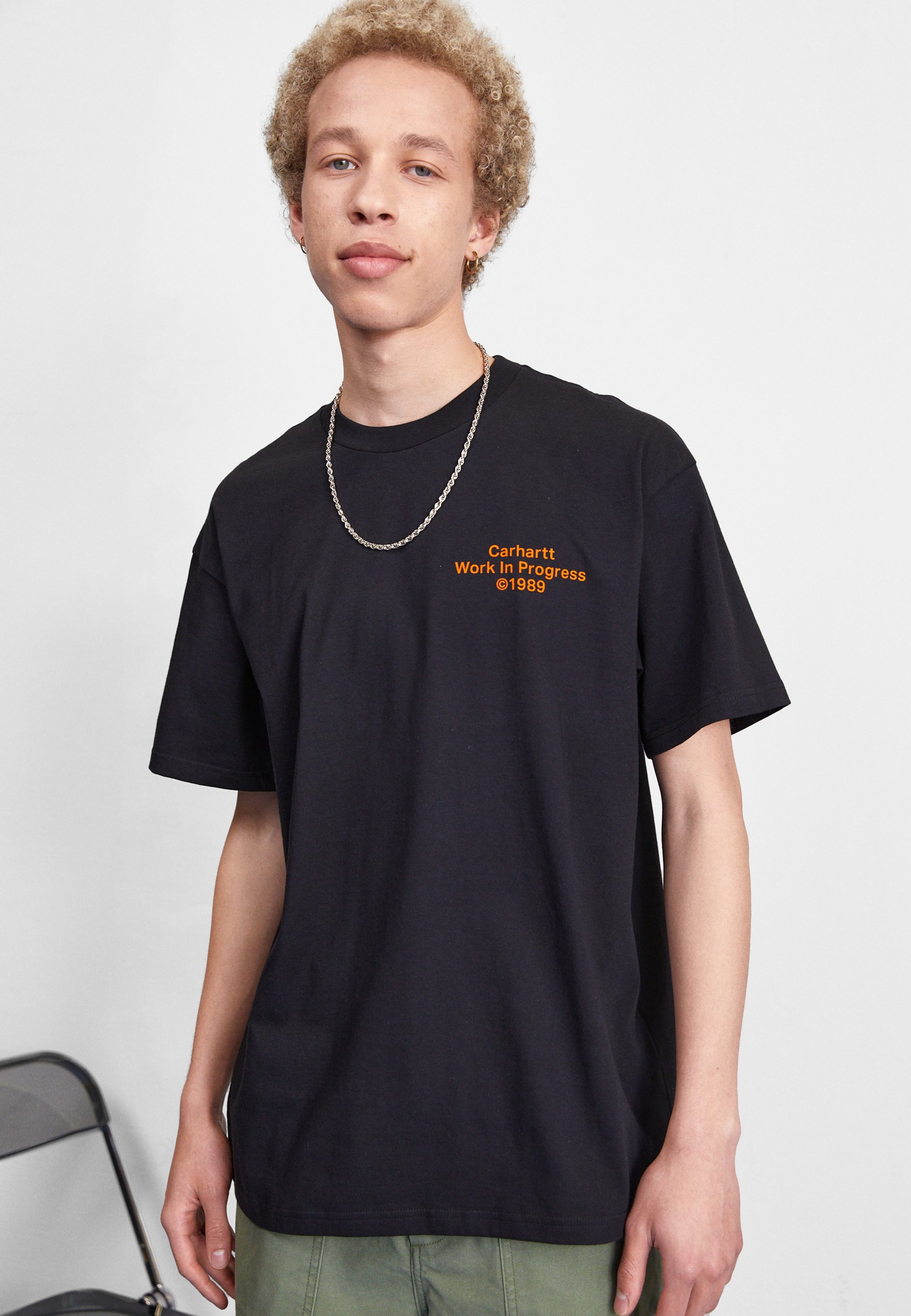 Carhartt WIP FORMATION - T-Shirt - print black/orange/schwarz