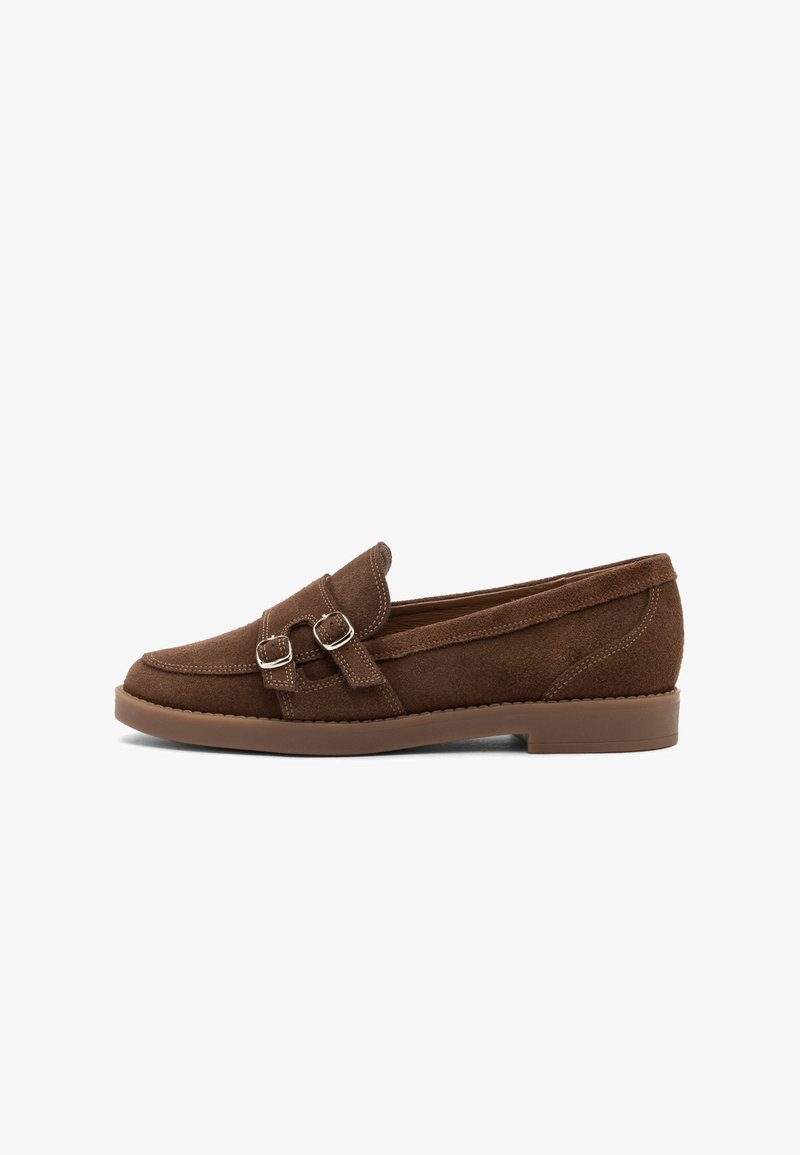 Brown suede loafer with double silver buckles, stitched details, and a low brown rubber sole.