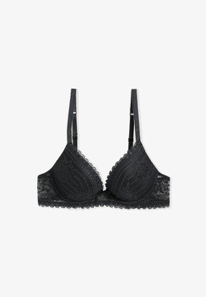 Soutien-gorge en dentelle noire avec un bord festonné, des bonnets triangulaires, des bretelles réglables et un joli nœud au centre, présentant un délicat motif floral.