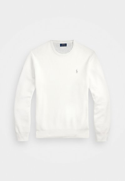 Balts džemperis, kas izgatavots no kokvilnas maisījuma, ar apaļu kakla izgriezumu, garām piedurknēm un mazu izšūtu logo kreisajā krūšu pusē.