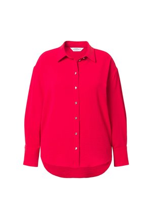 Blusa lunga rossa audace con maniche lunghe, colletto e bottoni argento, caratterizzata da una vestibilità comoda e un orlo leggermente curvo.