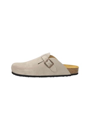 Beige suede clog with a round toe and a single adjustable buckle. It features a cork footbed and a textured black rubber sole.