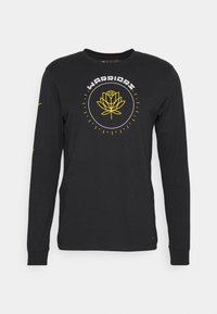 Czarna, długosleeve'owa koszulka z bawełny, z żółtym kwiatowym wzorem i napisem "WARRIORS" w okrągłym układzie na przodzie.