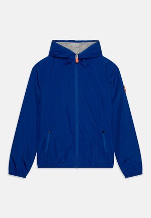Blue lightweight hooded jacket with a gray inner lining, front zipper, and two side pockets. Elastic cuffs and adjustable hood detail.