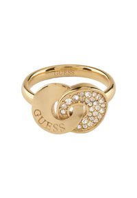 Gold-tone ring featuring a swirling design with one side set with clear crystals and the word "GUESS" engraved on the other side.
