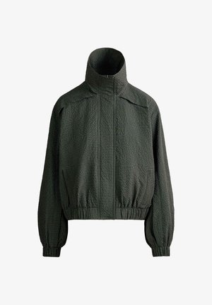 Black textured zip-up jacket with high collar, elastic cuffs, and waistband, featuring a grid-like pattern.