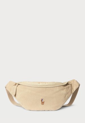 Beige fabric waist bag with zip closure and adjustable strap, featuring a small embroidered polo player logo on the front center.