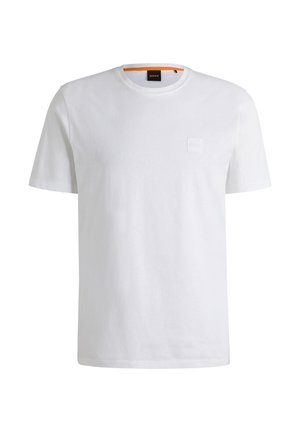 White cotton t-shirt with short sleeves and a crew neckline. Features a subtle front logo patch and an orange accent at the collar.