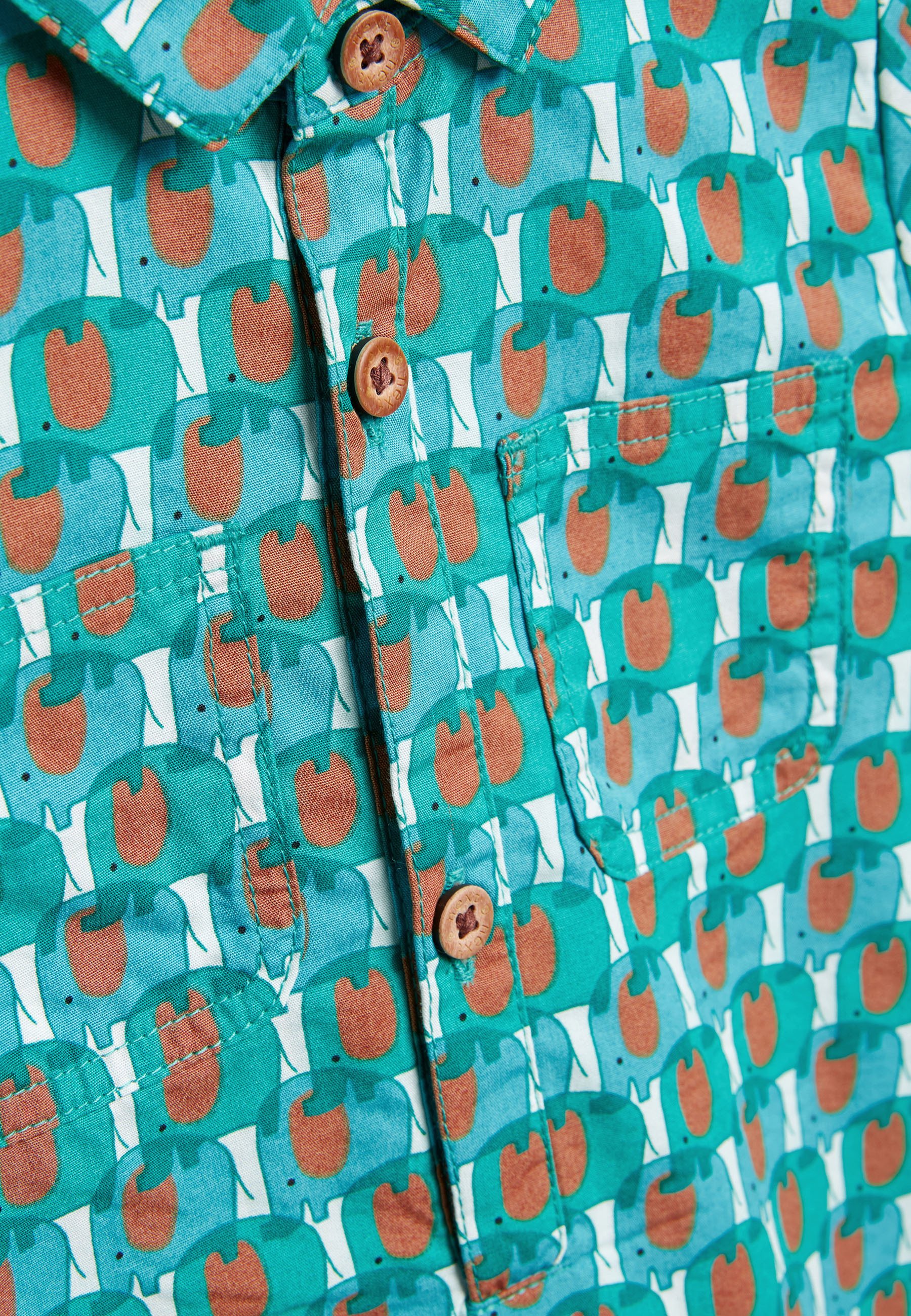 next green geo jumpsuit