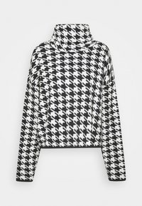 Czarno-biały sweter w wzór hounds-tooth z długim rękawem i lekko skróconym krojem na jednolitym tle.