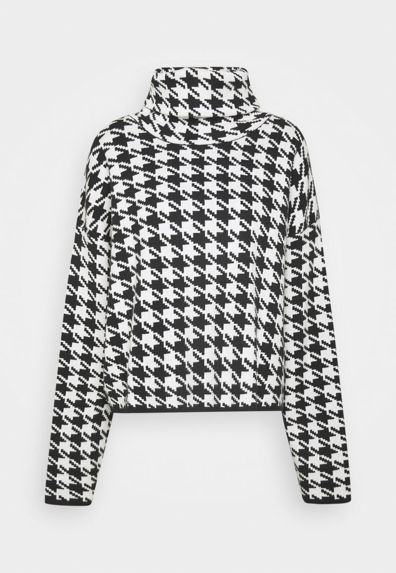 Czarno-biały sweter w wzór hounds-tooth z długim rękawem i lekko skróconym krojem na jednolitym tle.