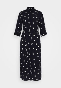 Abito navy con pois bianchi, chiusura a bottoni sul davanti, colletto e maniche a tre quarti. Include una cintura coordinata per stringere in vita.