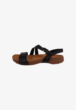 Sandales en cuir noir avec semelle en liège, dotées de brides croisées et d'une boucle. La semelle intérieure est de couleur naturelle avec un surpiqure détaillée.