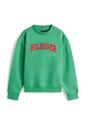Žalias ilgomis rankovėmis džemperis su raudonu užrašu „HILFIGER“ per krūtinę, su apsiūtais rankogaliais ir apačia.