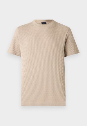 T-shirt beige à manches courtes en coton côtelé avec un col rond et un motif texturé vertical subtil.