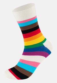 Ένα πολύχρωμο καρό κάλτσας με πολλές οριζόντιες ρίγες σε αποχρώσεις κόκκινου, μπλε, καφέ, μαύρου, κόκκινου, πορτοκαλί, κίτρινου και πράσινου. Μαλακό πετρούλη.