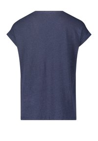 Námořnická modrá trička s krátkým rukávem, volný střih a jednoduchý, jednobarevný design. Vyrobeno z měkkého, texturovaného materiálu, s kulatým výstřihem.