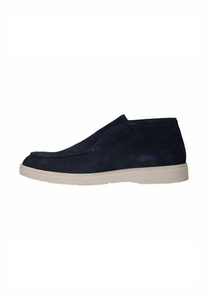 Navy blue suede slip-on shoe with a white rubber sole and low ankle height, shown from the side on a white background.