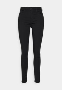 Μαύρα λεπτά τζιν με υψηλή μέση. Φτιαγμένα από ελαστικό ύφασμα, με λεία υφή, πέντε τσέπες και κλείσιμο με φερμουάρ.
