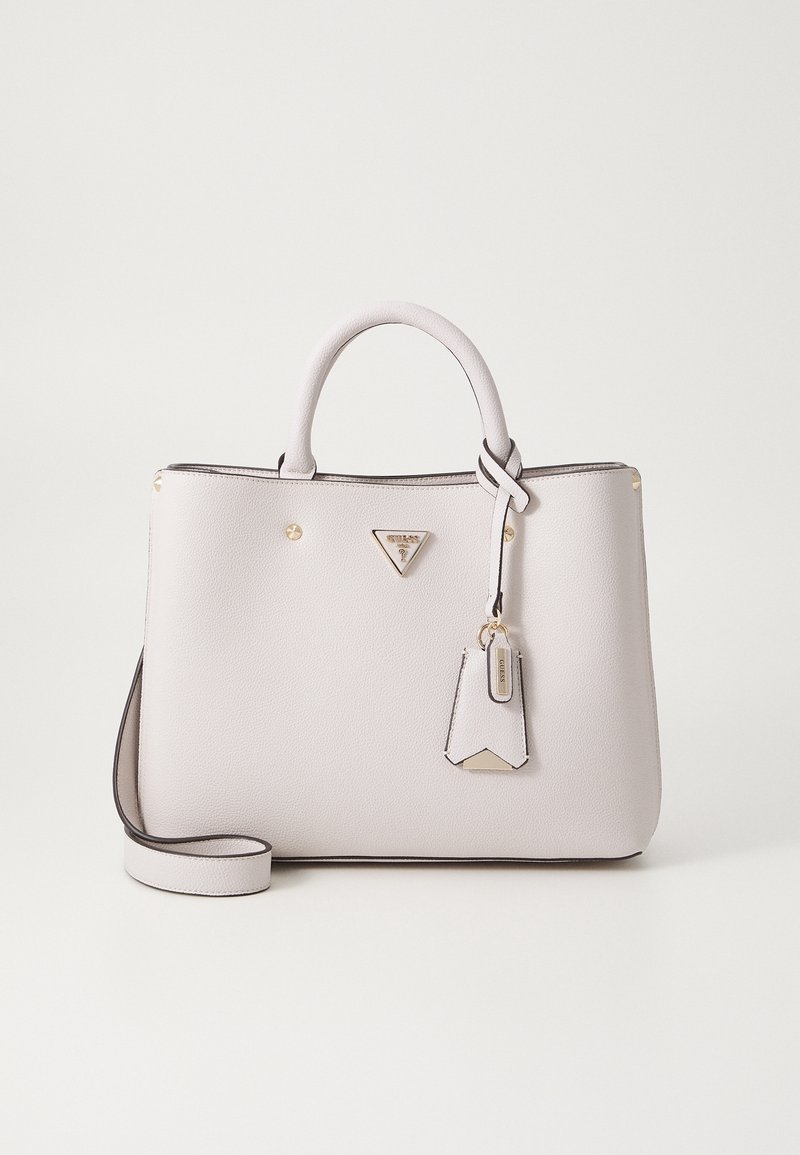 White structured leather handbag with dual handles, gold-tone logo plaque, and detachable strap on a plain light background.