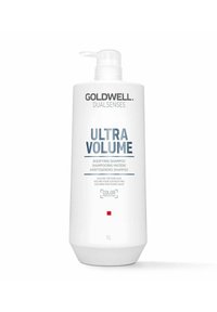 White plastic bottle with a pump dispenser. Label features "Goldwell Dualsenses Ultra Volume" in blue text. 1L capacity, color protection indication.