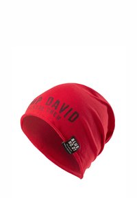 Red cotton beanie with a slouchy design. Features black printed text "PUMP DAVID COASTAL CREW" and a branded tag on the side.