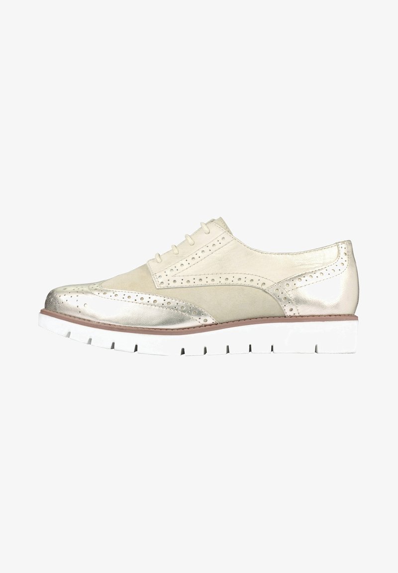 Scarpa beige chiaro con accenti metallici, dettagli brogue e suola in gomma bianca. Texture liscia con punta arrotondata e design con lacci.