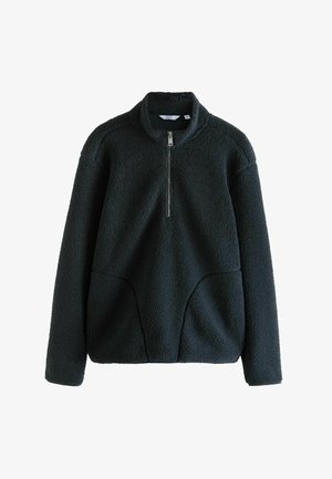 Pull en polaire vert foncé avec un zip de moitié à l'avant, un col haut et de grandes poches avant. Texture douce avec un aspect accueillant.