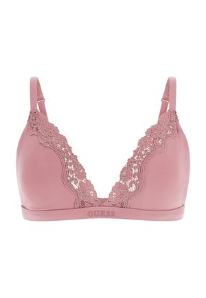 Pink bra with a smooth fabric and floral lace trim along the neckline. Features adjustable straps and an elastic band with "GUESS" logo.