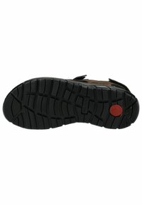 Zwarte rubberen schoenzool met een gestructureerd profiel, voorzien van een rode cirkelvormige accent en inkepingen voor grip. Stevig en duurzaam ontwerp.