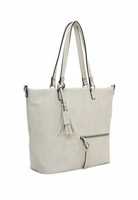 Lichtgrijze tote bag van faux leer, met een ritsvak aan de voorkant, een afneembare kwast en contrasterende zwarte handvatten.