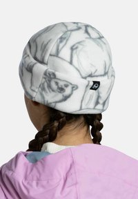 White fleece beanie featuring a gray polar bear print, designed with a rounded shape and a small branded tag on the side.