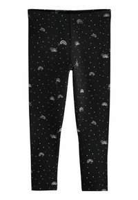 Svarta leggings med vita prickar och små regnbågs mönster. Tillverkade av elastiskt tyg för komfort och rörelse.