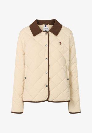 Prešivena svjetlo bež jakna s smeđim manšetama od voštanog štofa, kopčama na drukere i malim vezenim logotipom na lijevoj strani prsa.