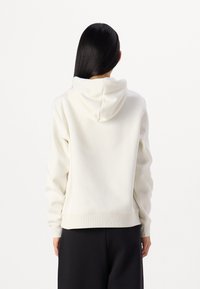 Calvin Klein Jeans MONOLOGO REGULAR HOODIE - Džemperis su gobtuvu - ivory