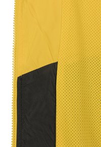 Urban Classics TONE TECH - Vjetrovka - yellow/black