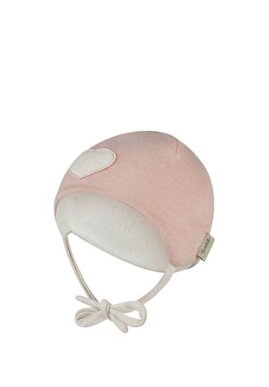 Soft pink baby hat with white heart patch, ear flaps, and tied straps under the chin.