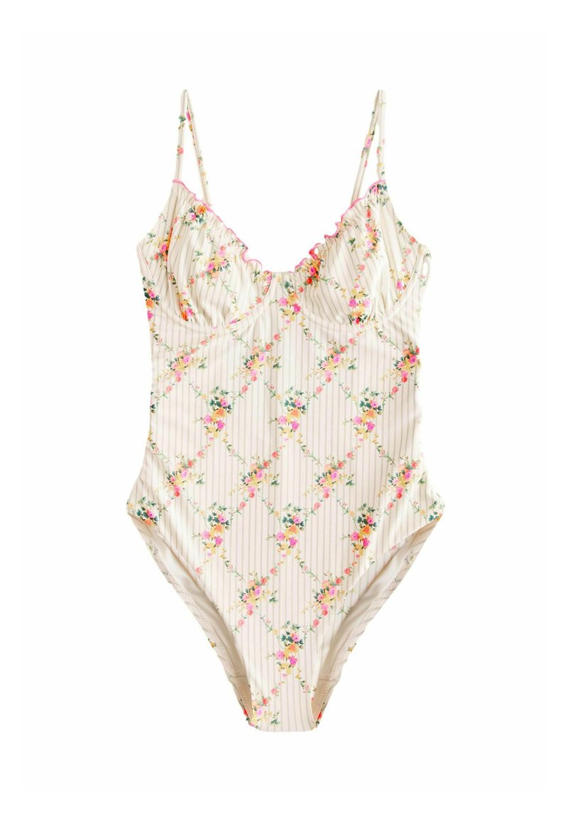 Eén stuk badpak in off-white met een bloemmotief en verticale strepen. Heeft dunne verstelbare bandjes en gerimpelde randen aan de halslijn.