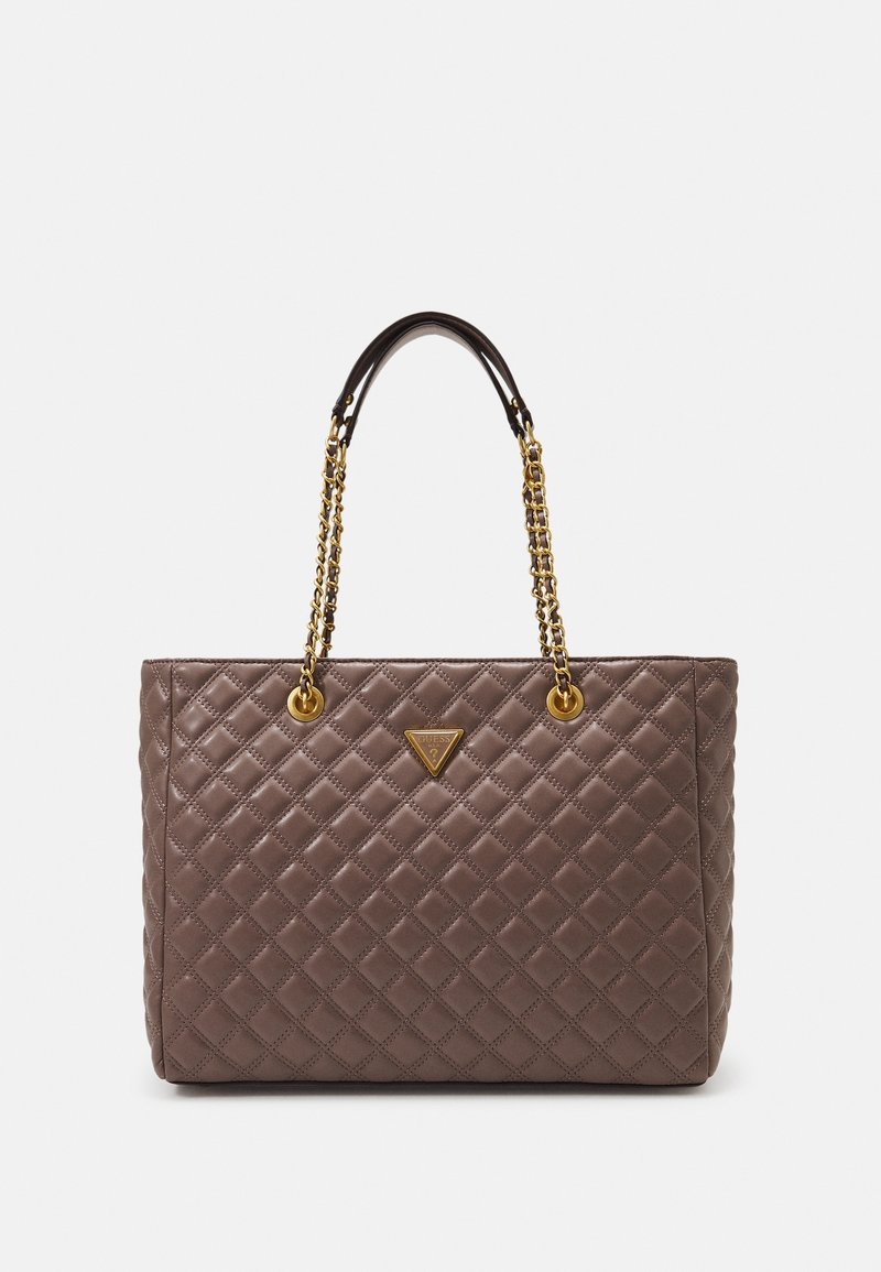 Sac à main en cuir matelassé marron avec des anses en chaîne dorée et une petite plaque de logo triangulaire au centre avant.