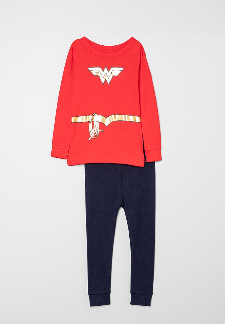 Czerwona bluzka z długim rękawem z emblematem Wonder Woman, zestawiona z ciemnoniebieskimi legginsami. Miękka bawełniana tkanina o gładkiej strukturze i minimalistycznym wzornictwie.