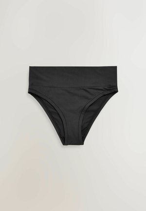 Mustad kõrge vöökohaga aluspüksid lai vöötme, lamedate õmblustega ja siledast, venivast kangast, millel on hele taust.