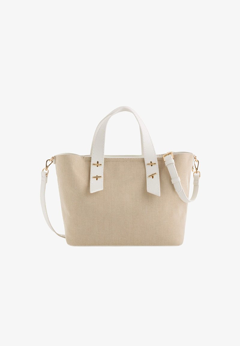 Beige canvas tote bag with white faux leather handles and adjustable strap. Features gold-tone hardware and a textured surface.