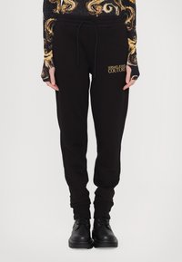 Versace Jeans Couture Tepláky - black/gold coloured