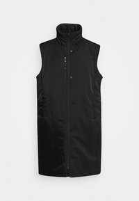 Svart ärmlös väst i slät tyg, med hög krage, dragkedja fram och tryckknappar, samt en diskret logotypdetalj fram.