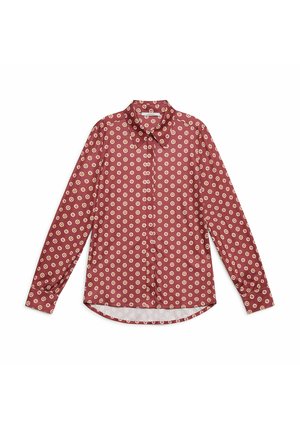 Camicia rossa con motivo a pois e dettagli gialli, con colletto a punta, bottoni sul davanti e maniche lunghe con polsini arrotondati.