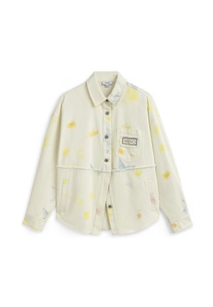 Beige langarmig overhemd met knopen, voorzien van abstracte gele en blauwe vlekken, een borstzak aan de voorkant met het label "MERCI" en een rafelige zoom aan de taille.