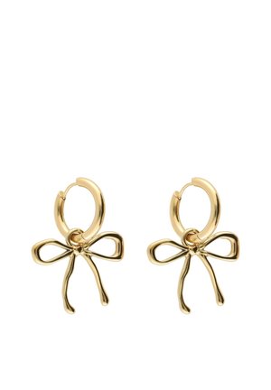 Boucles d'oreilles créoles en or avec de délicats pendentifs en forme de nœud suspendus à chaque créole.