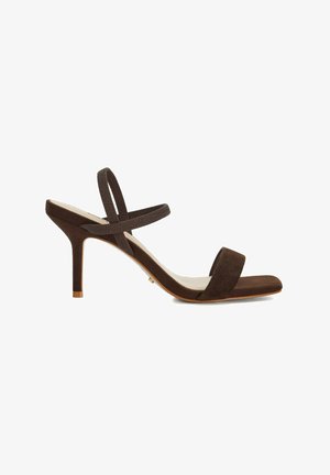 Brown suede high-heeled sandal with two slender straps, a square toe, and a slim stiletto heel. Features a light-colored insole.