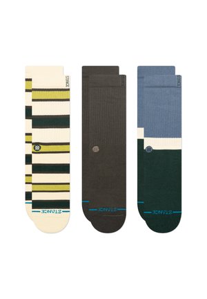 Three pairs of socks: one with yellow and green stripes, one solid dark grey, and one in blue with a green accent. Each has logo detail.