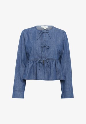 Blue denim long-sleeve blouse with round neckline, three tied bows down the front, and a gathered, peplum-style waist.